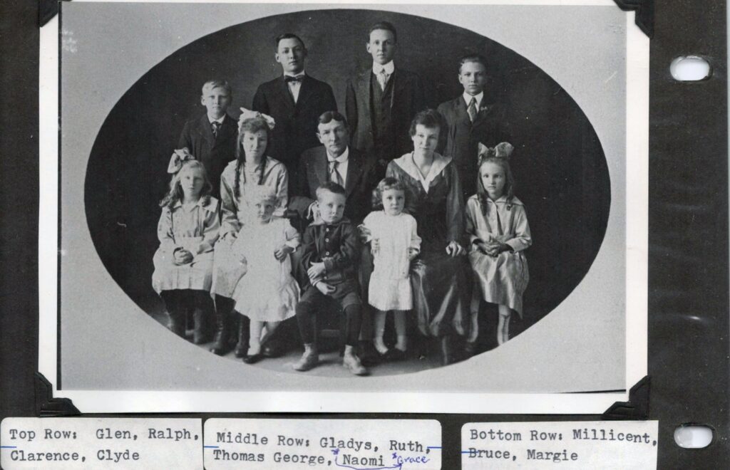 Family photo of Thomas George Naylor minus his wife who has passed away. Top Row: Glen, Ralph, Clarence, Cylde. Middle row: Gladys, Ruth, Thomas, Naomi, Grace. Bottom row: Millicient, Bruce, Margie.